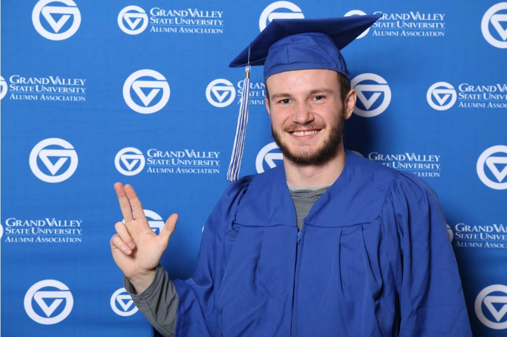Future alumnus smiles for a photo at Gradfest